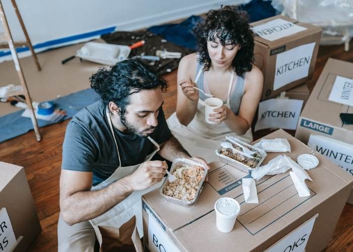 Couple eating after moving house