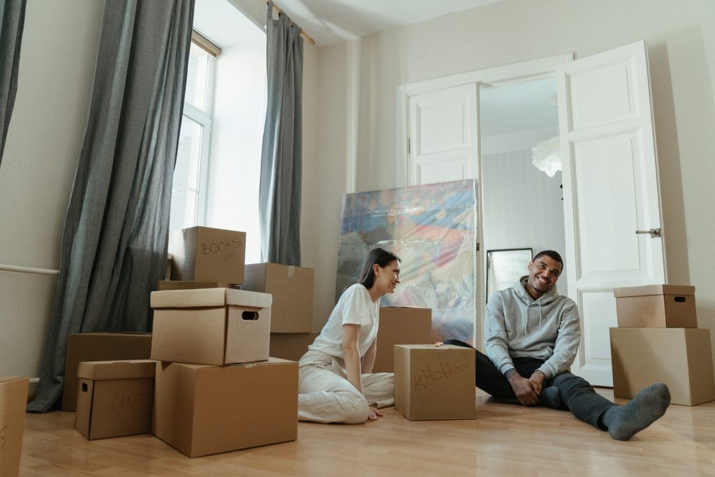 couple relaxing after packing boxes