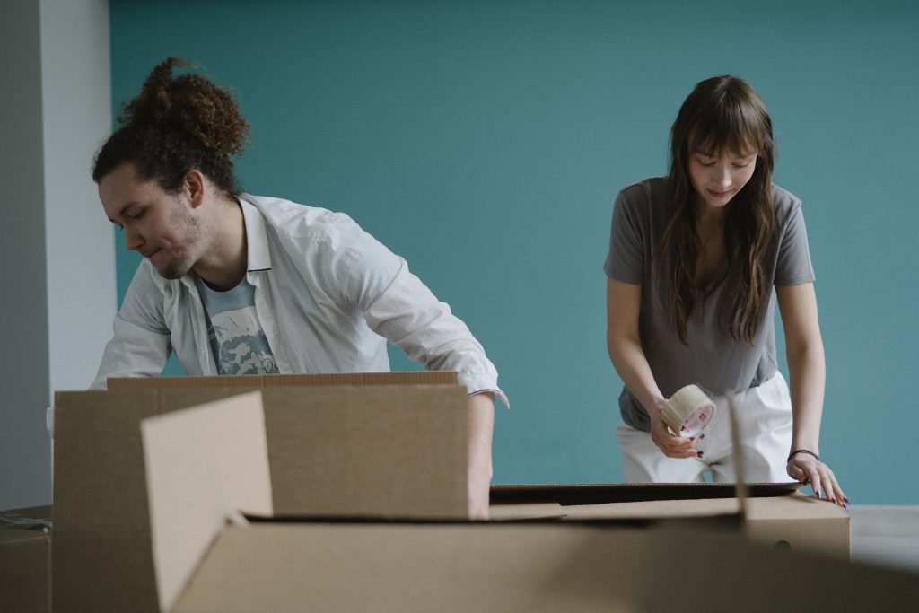 Students taping up boxes for storage