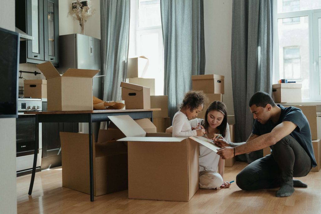 Family writing contents of box