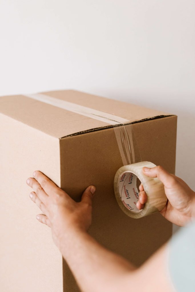 Sealing a box with tape